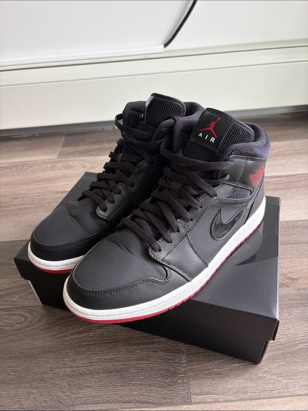Jordan Mid-Top Sneakers in Black with Red Accents